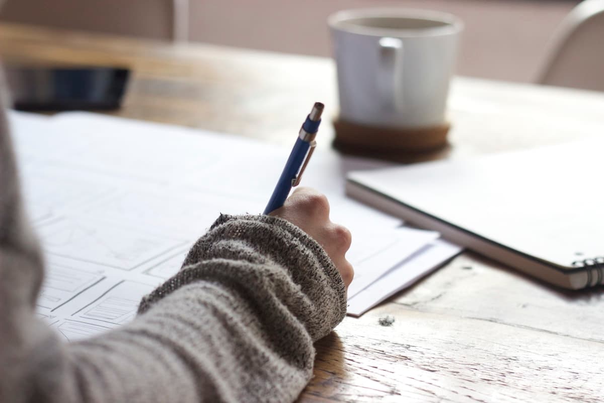A graduate school applicant studying and preparing to contact professors